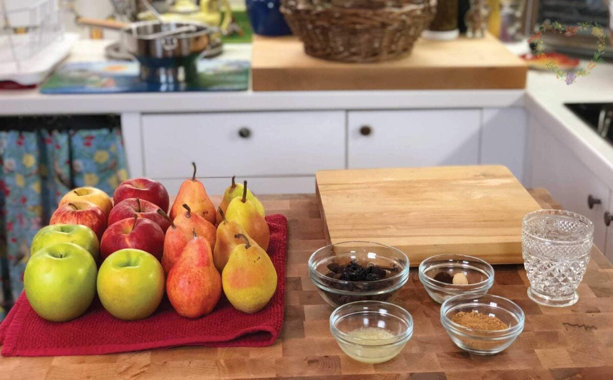 Apples, Pears, and additional ingredients on a cutting board