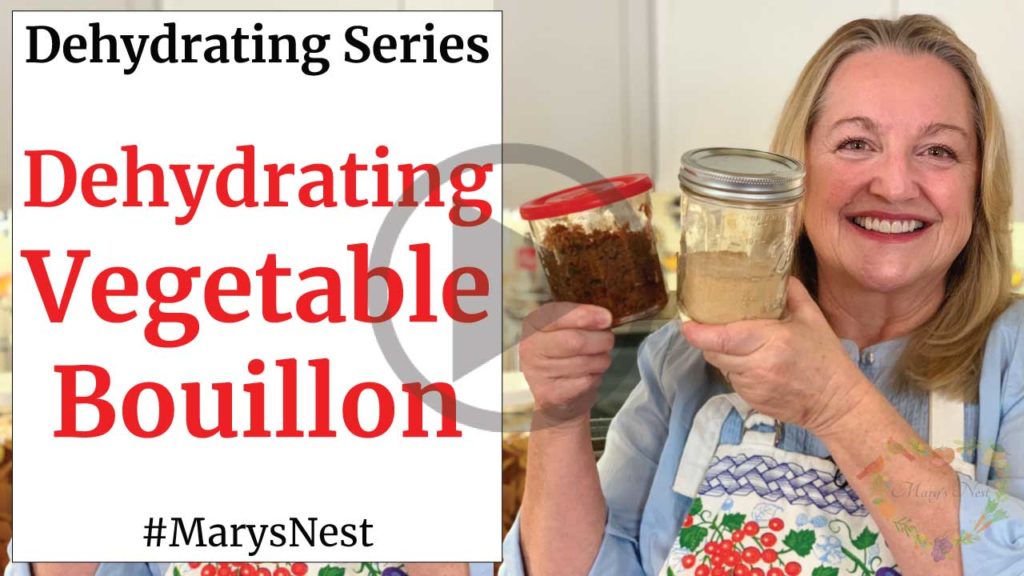 Mary holding two jars of dehydrated homemade vegetable bouillon.