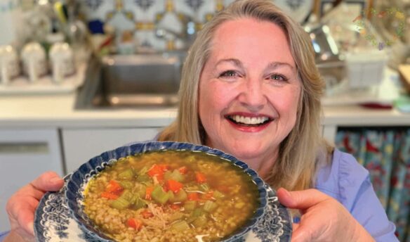 Mary's holds a bowl of chicken soup that was made with bone broth.