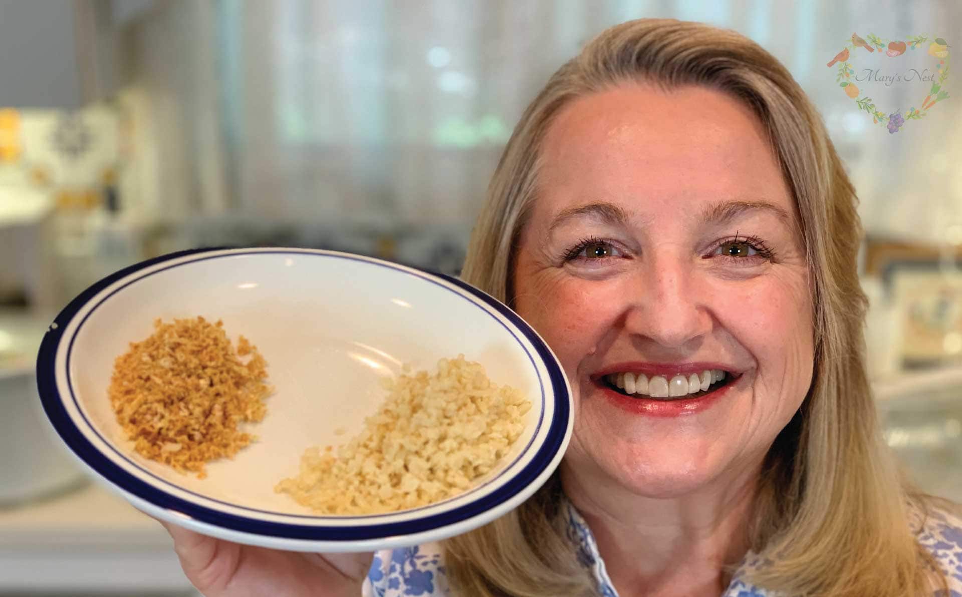 Mary holding a plate with dehydrated cauliflower rice.