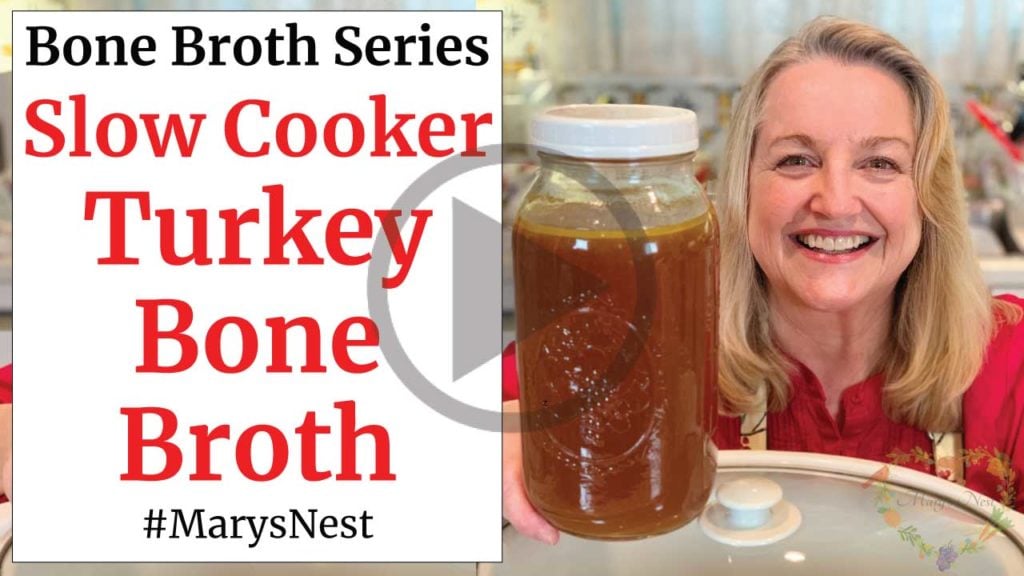 Mary holding a container of Turkey Bone Broth.