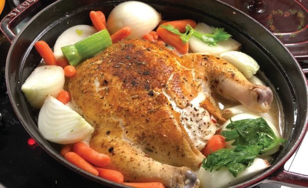 Praised Chicken in an oval dutch oven.