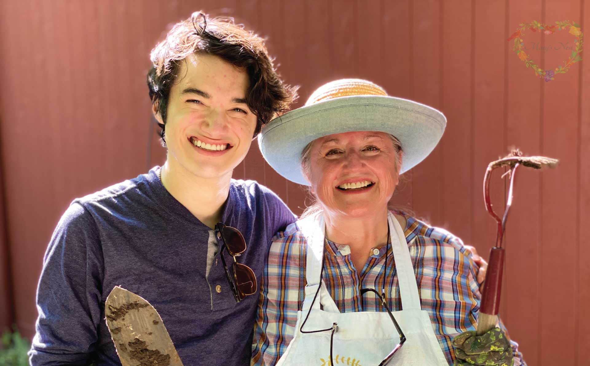 Mary with her son Ben in their kitchen garden.