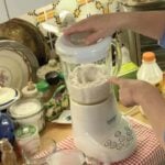 Making the blender pancake batter on a kitchen counter.