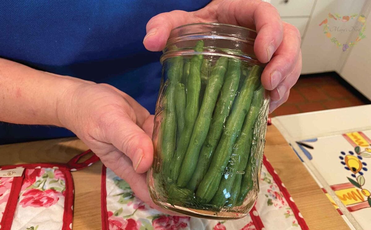 Packed green beans in mason jar for pickling
