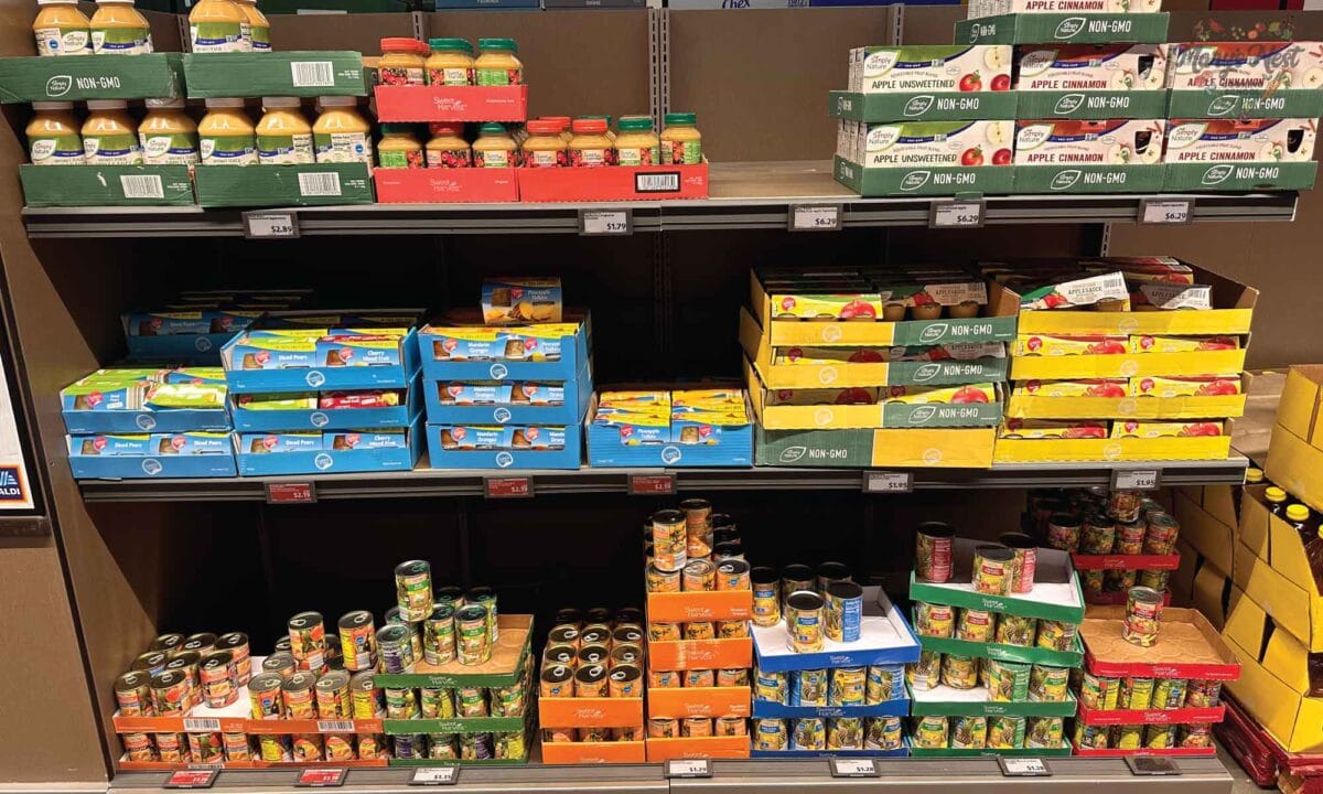 Showing shelves of canned fruit at Aldi.