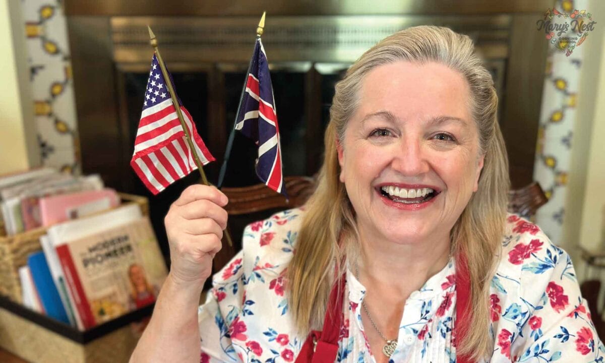 Mary holding United States and UK Flags
