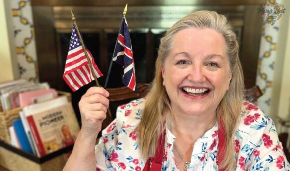 Mary holding United States and UK Flags