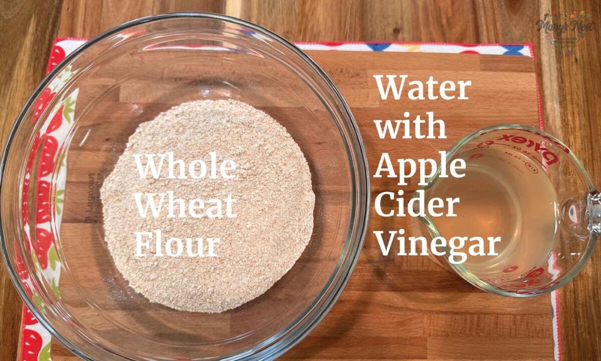 Soaked Flour Preparing Ingredients showing whole wheat flour and water with apple cider vinegar.