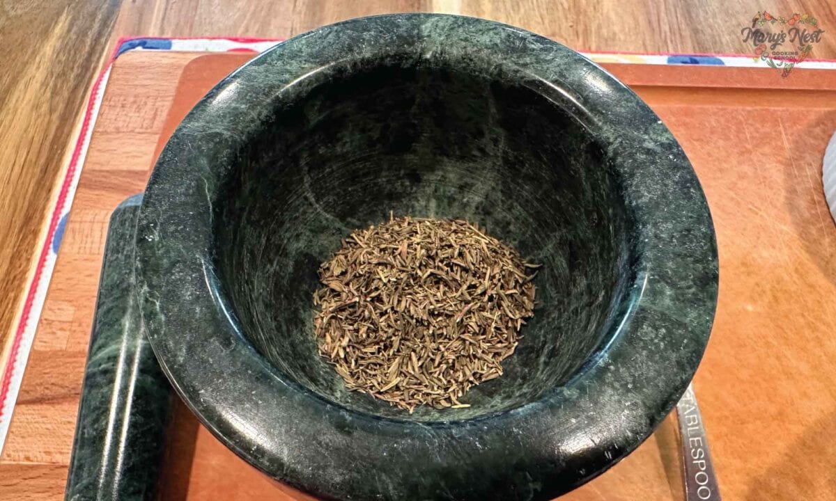 Mortar and pestle with dried thyme