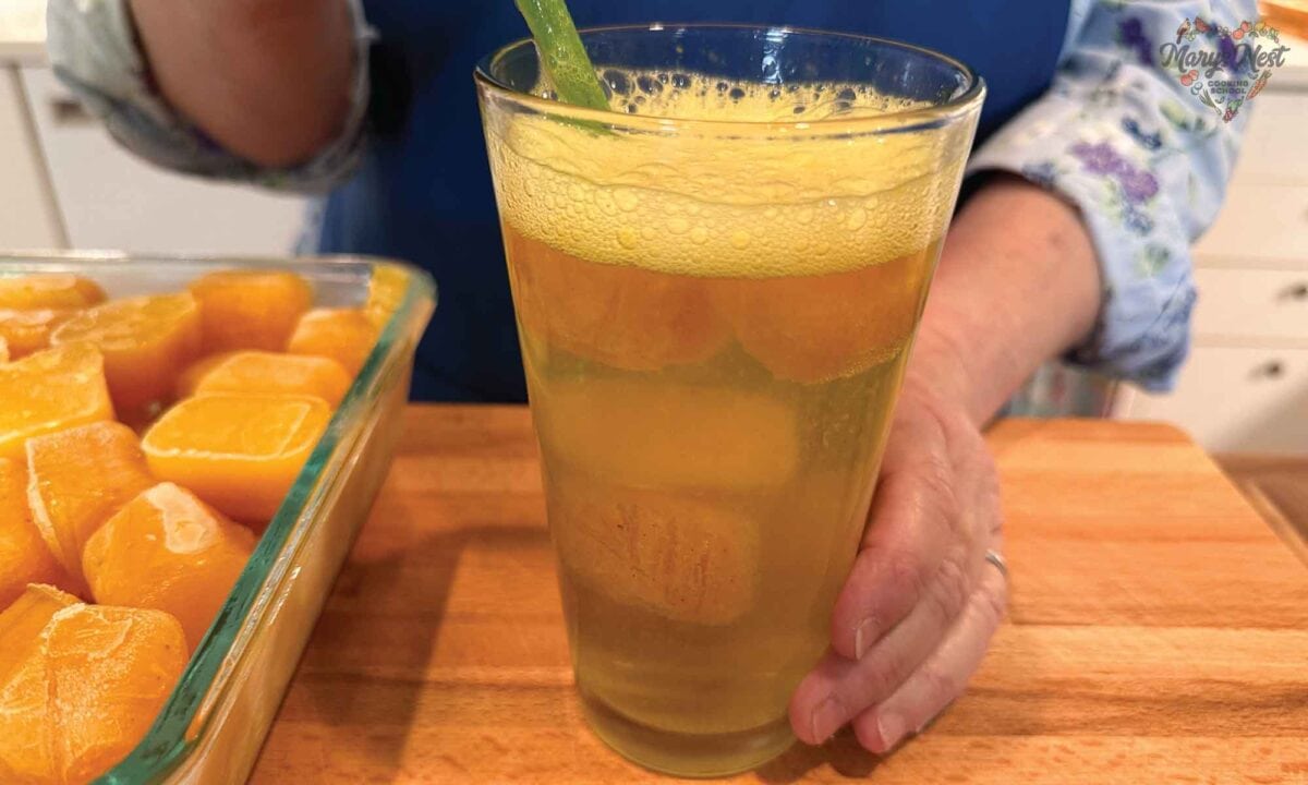 Turmeric Tea Ice Cubes served as a cold drink in a glass.