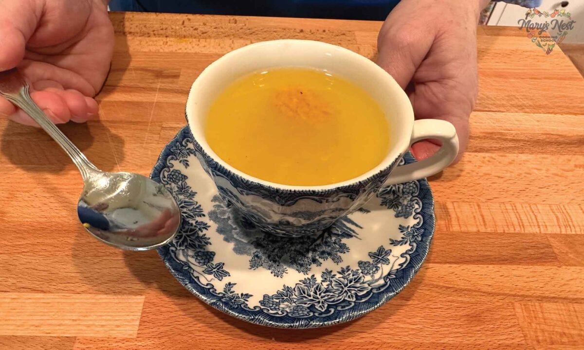 Turmeric Tea Ice Cubes served as a hot drink in a teacup.