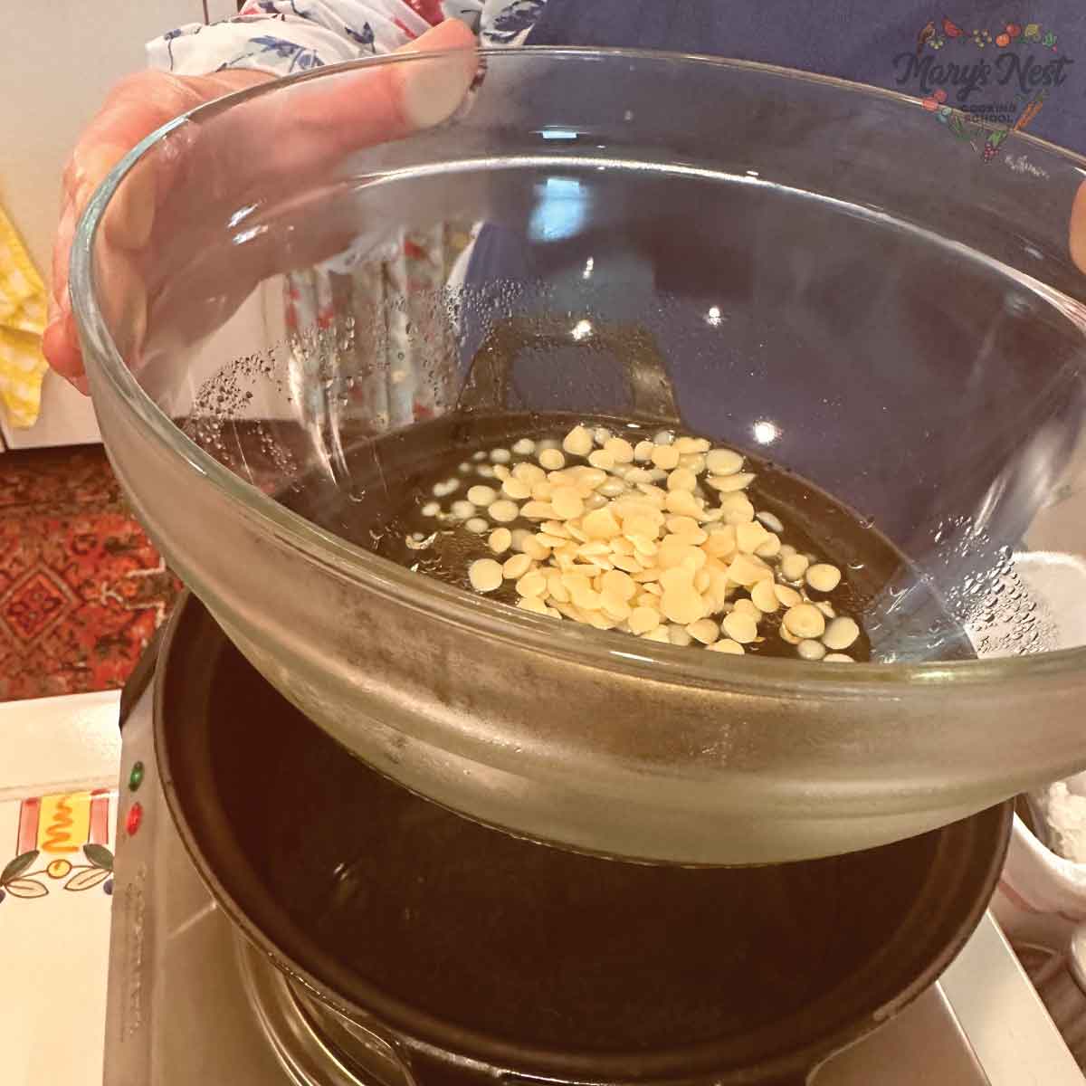 Using a Double Boiler with a glass bowl over a cast iron pot.