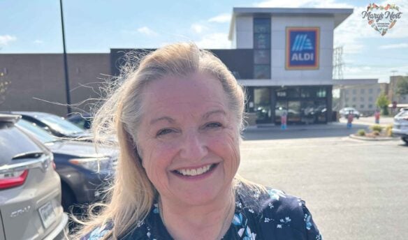 Mary standing outside of an Aldi store.