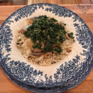 Kippers with rice and parsley mixture in bowl.